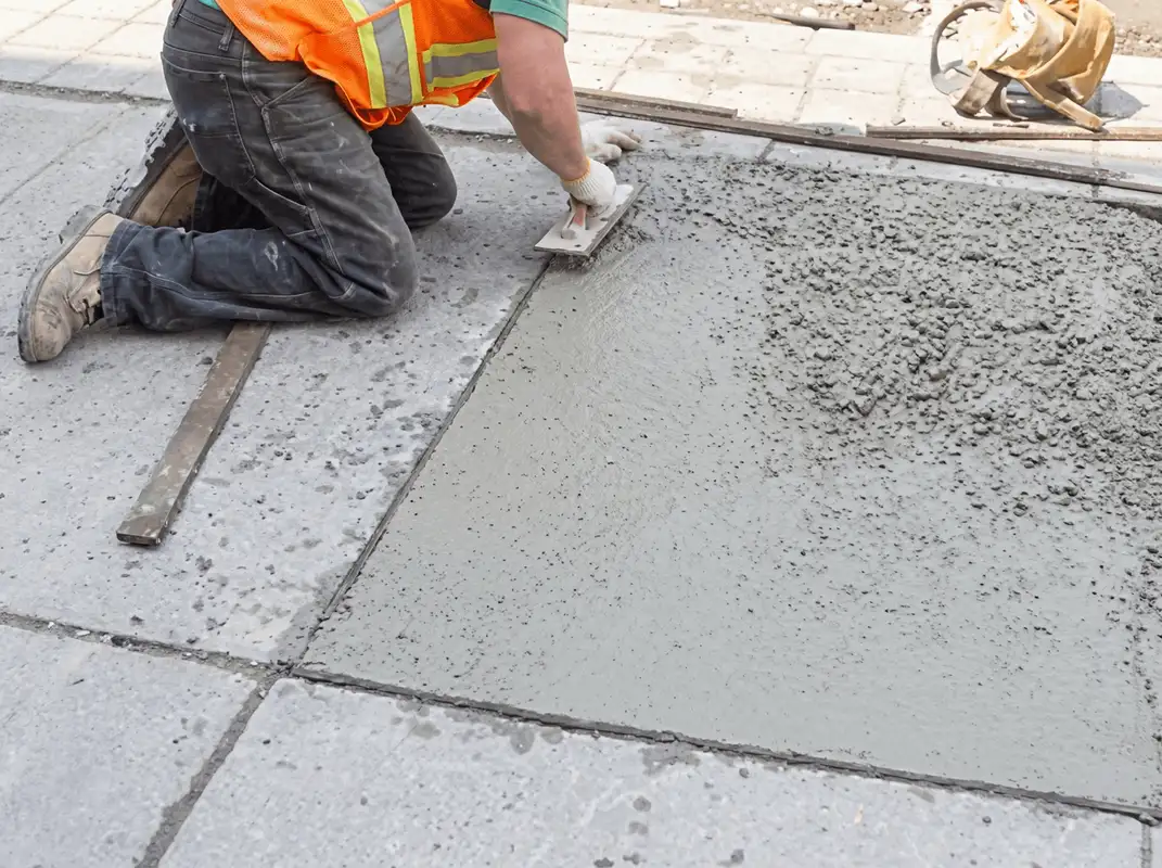 Professional repairing a concrete floor in Pasadena, CA